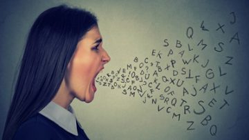 angry woman screaming alphabet letters flying out of mouth